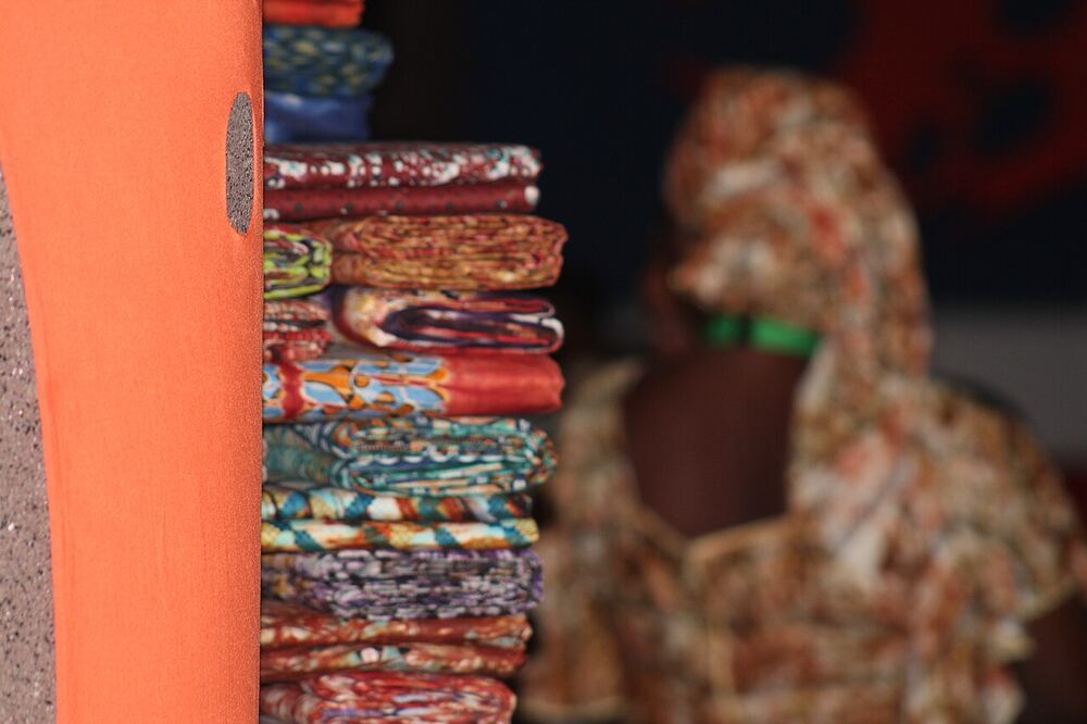 Colourful African fabrics at a market stall