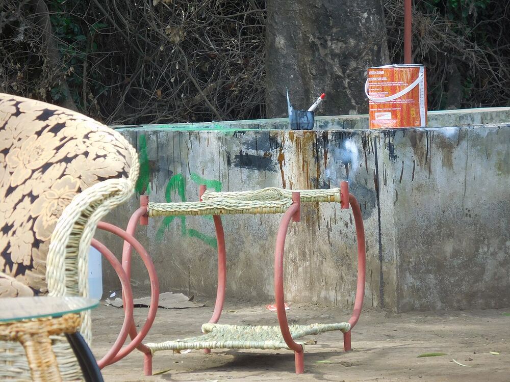 A roadside furniture seller with wicker chairs and tables